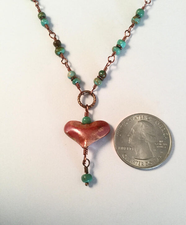 close up of delicate heart necklace